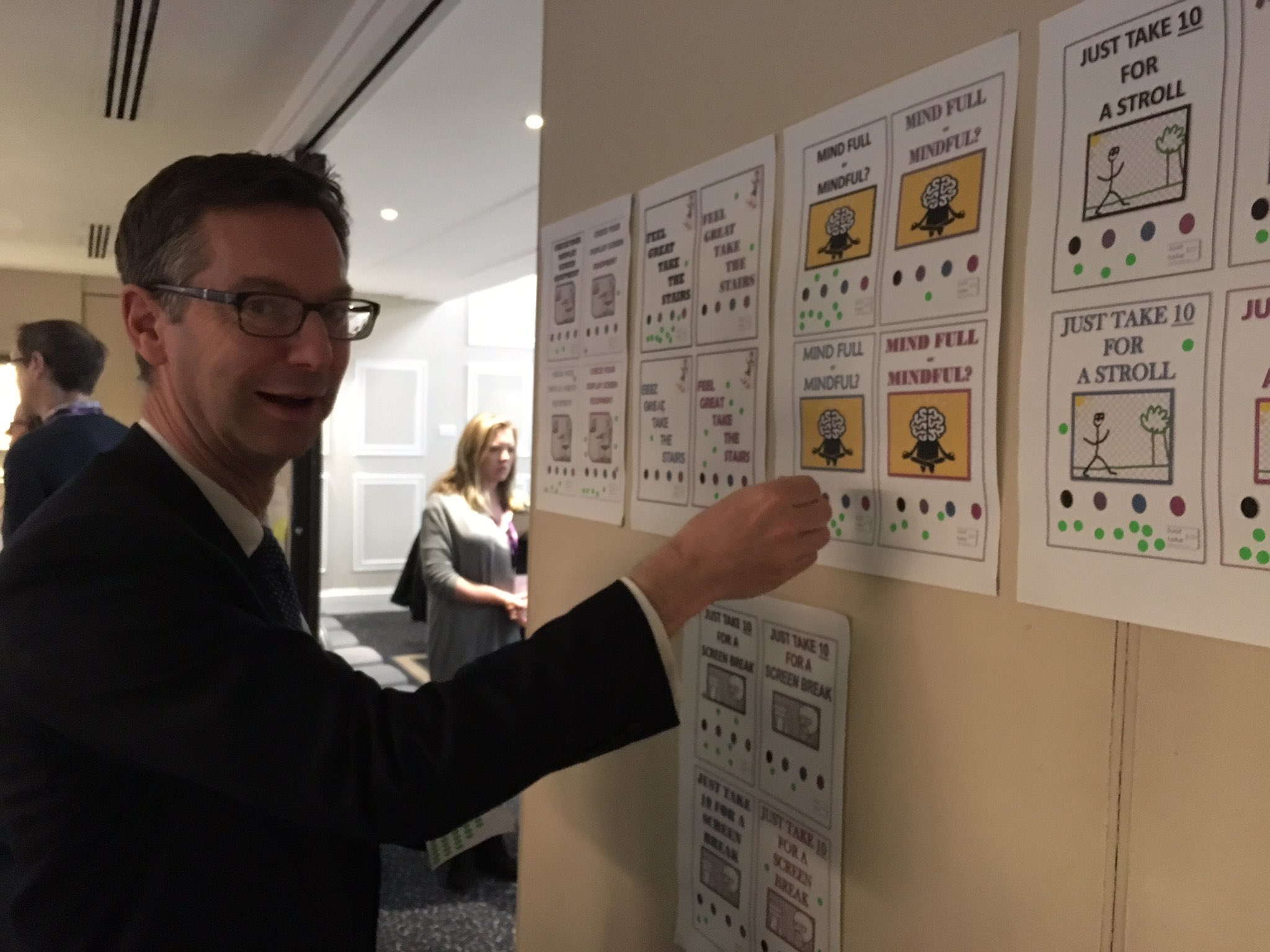 Peter Schofield engaging with the wellbeing material produced by one of the learning groups from Cohort 5 of the DWP Project Leadership Academy (photo: James Kemp)